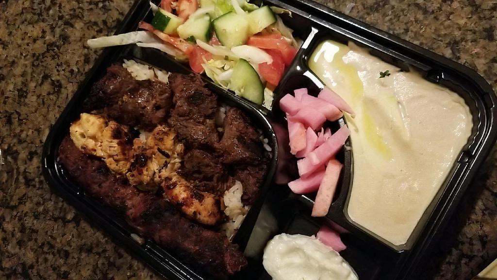 Mixed Kabob Plate · Ground beef kabob, chicken kabob and shish kabob served with french fries or rice, salad, hummus, garlic sauce, pickles and 2 pita bread.