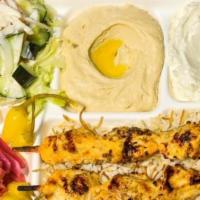Chicken Kabob Plate · Marinated white chicken, served with french fries or rice, salad, hummus, garlic sauce, pick...