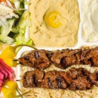 Shish Kabob Plate · Marinated filet mignon served with french fries or rice, salad, hummus, garlic sauce, pickle...