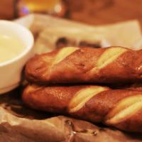 Beer Cheese Dip & Pretzels · Warm soft pretzels served with a creamy cheese dip made in house with a hoppy I.P.A.