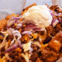 Loaded Chili Tots · All the best things piled together! Tots covered in our house made chili, topped with a shre...