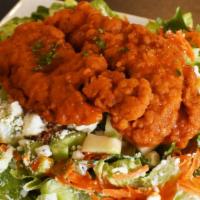 Buffalo Chicken Salad · Crispy buffalo chicken, bleu cheese crumbles, diced apples, celery & shredded carrots over c...