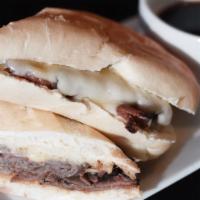 French Dip · Thinly sliced roast beef & melted Swiss served on a toasted French roll with a side of mouth...