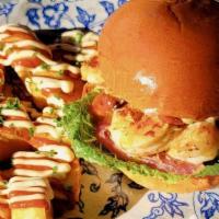 Sandwich De Camarones · wild caught shrimp | lettuce | pickled onion | tomato | aioli | brioche bun