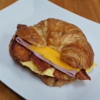 #10 Bacon, Ham, Egg With Cheese Hot Breakfast Sandwich · Hot breakfast made to order. Bread choice of croissant, toast or bagel. Comes with bacon, ha...