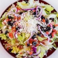 Greek Salad · Lettuce, tomato, olive, onion, and goat cheese with lime and olive oil dressing.