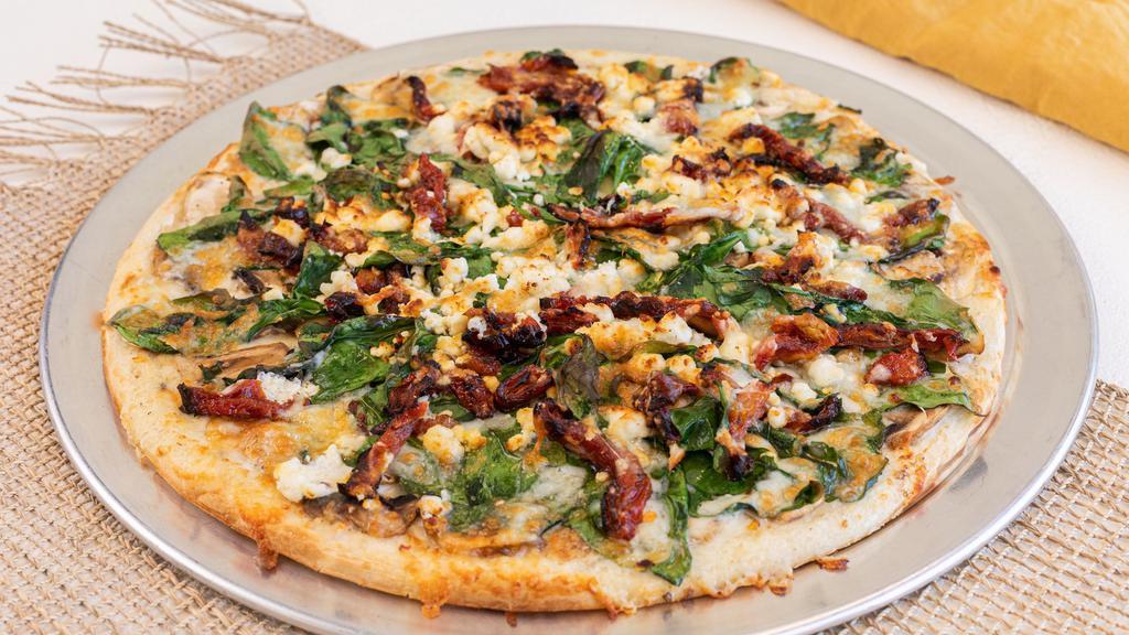 Spinach & Goat Cheese Pizza · Ranch sauce, spinach, sun-dried tomato, mushroom, goat cheese, and mozzarella cheese.