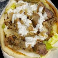 Lamb Gyro · Seasoned grilled lamb gyro, with grilled onions, lettuce, and tomatoes topped with our speci...