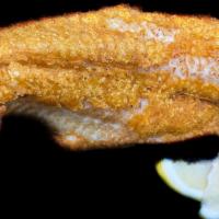 Fried Fish · Fried fish with a slice of lemon.