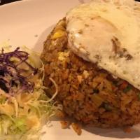 Kimchi Fried Rice Special · Kimchi,rice,onins,green onions,carrots topped with a fried egg served with cabbage salad and...