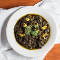 Palak Paneer · Paneer (fresh cheese) cooked  in spinach and spices