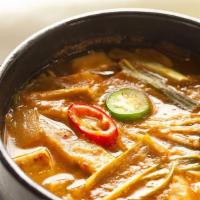 Doenjang Jjigae Soup · Pork broth and Korean doenjang based stew with tofu, beef and vegetables.