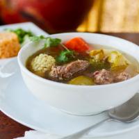 Caldo De Res · Served with small side of rice and regular corn tortillas.