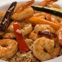 Shrimp Stir-Fry · Sautéed in olive oil, lemon, butter and garlic with Cajun spices and cut fresh vegetables, s...