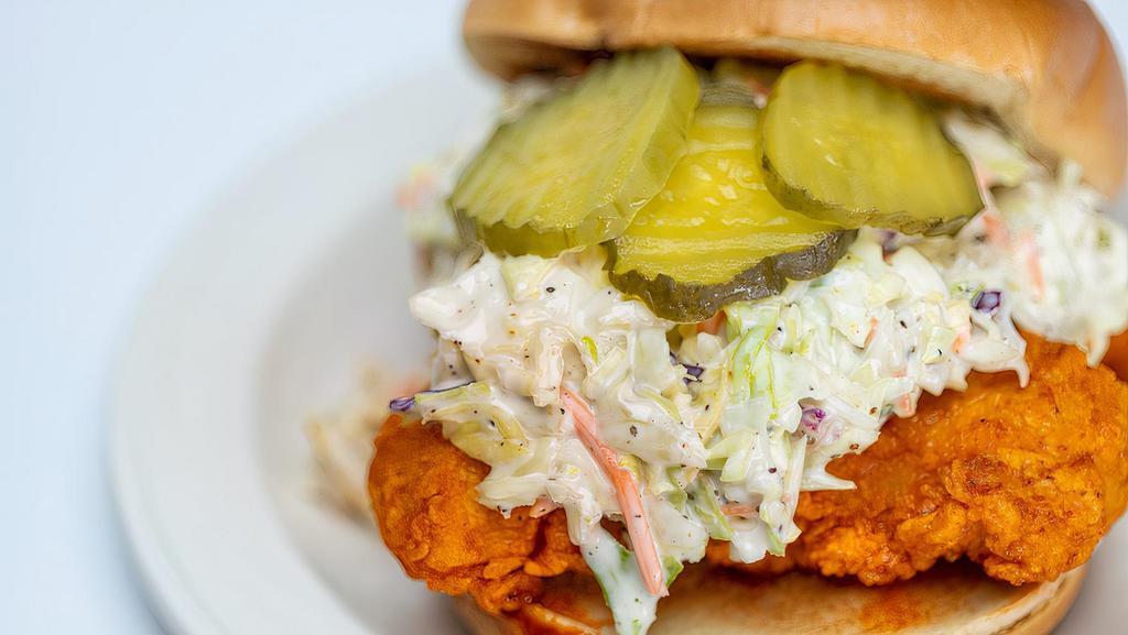 Red’S Nashville Hot Chicken Sandwich (R) · Toasted brioche bun with crispy chicken tossed in Nashville Hot sauce and cajun seasoning, coleslaw, pickles and Red’s sauce!