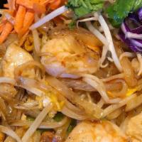 Pad Thai · Gluten-free. Stir-fried thin noodles with eggs, bean sprouts, green onions, ground peanuts a...