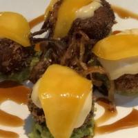 Crab Cakes (4Pieces) · Fried imitation crab served on a bed of avocado with mango and Hawaiian sauce