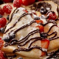 Chocolate Strawberry Crepes (950-1050 Cal) · Three crepes stuffed with vanilla whipped cream cheese and drizzled with chocolate sauce. Wi...