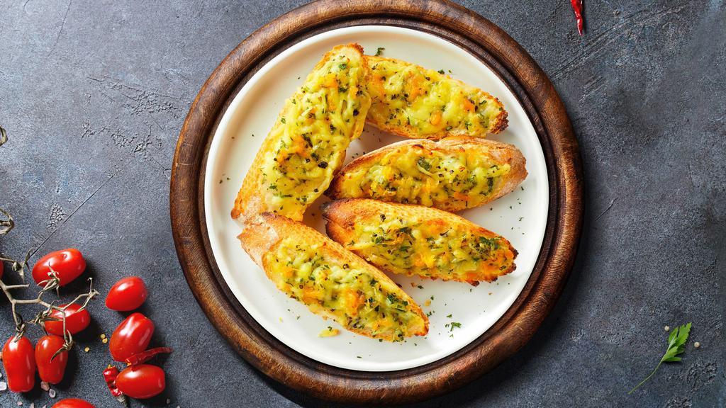 Cheese It Up Garlic Bread · Toasted bread baked with garlic butter, mozzarella, and parsley.