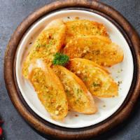 The Great Garlic Bread · Toasted homemade bread baked with garlic butter, and parsley.