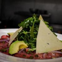 Carpaccio De Lomo · Thin Sliced Beef Tenderloin | Arugula | Shaved Parmesan Cheese | Capers | Red Onions | Avoca...