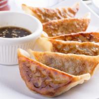 Pan-Fried Gyoza (6Pc. Pot Stickers) · beef and vegetable potsticker.