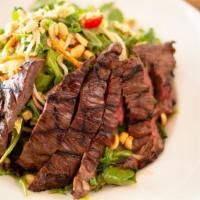 Thai Steak Salad · Red cabbage, noodles, red onions, red bell peppers, carrots, mango, cherry tomatoes, peanut ...