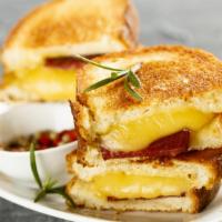 The Sausage, Egg & Cheese Sandwich · Satisfying sandwich prepared with a medium egg, sausage and cheddar cheese. Served with your...