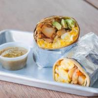 Breakfast Burrito · 2 eggs, cheddar cheese, homestyle potatoes, avocado, sauteed onions & peppers, fresh spicy s...