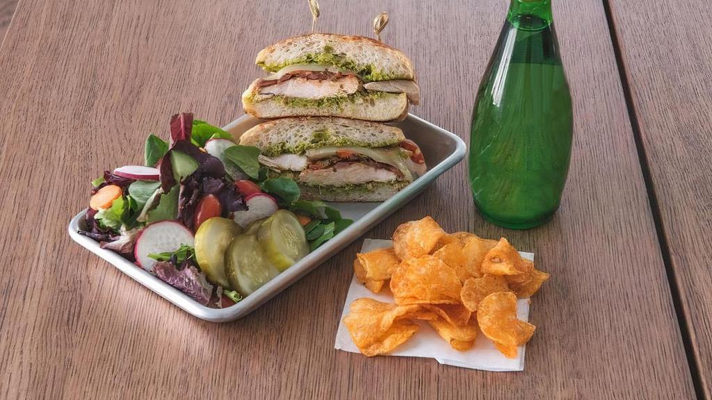 Chicken Pesto Panini Combo · Grilled chicken, roasted garlic tomatoes, balsamic caramelized onions, melted Swiss cheese, pesto on a ciabatta roll. Comes with chips and drink.