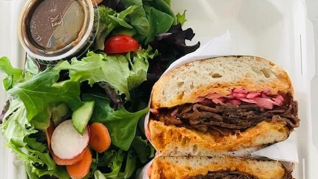 Bbq Brisket Panini Combo · 14 Hour Smoked BBQ Brisket, melted cheddar cheese, pickled onions, chipotle mayo, served with side salad and pickles.  Comes with chips and a drink
