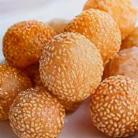 Sesame Ball(6)芝麻球 · Made with a sticky rice flour dough, filled with a sweet red bean paste, rolled in sesame se...