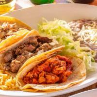 Three Tacos · Served with soft warm tortillas and fresh salsa, with charbroiled choice of meat.