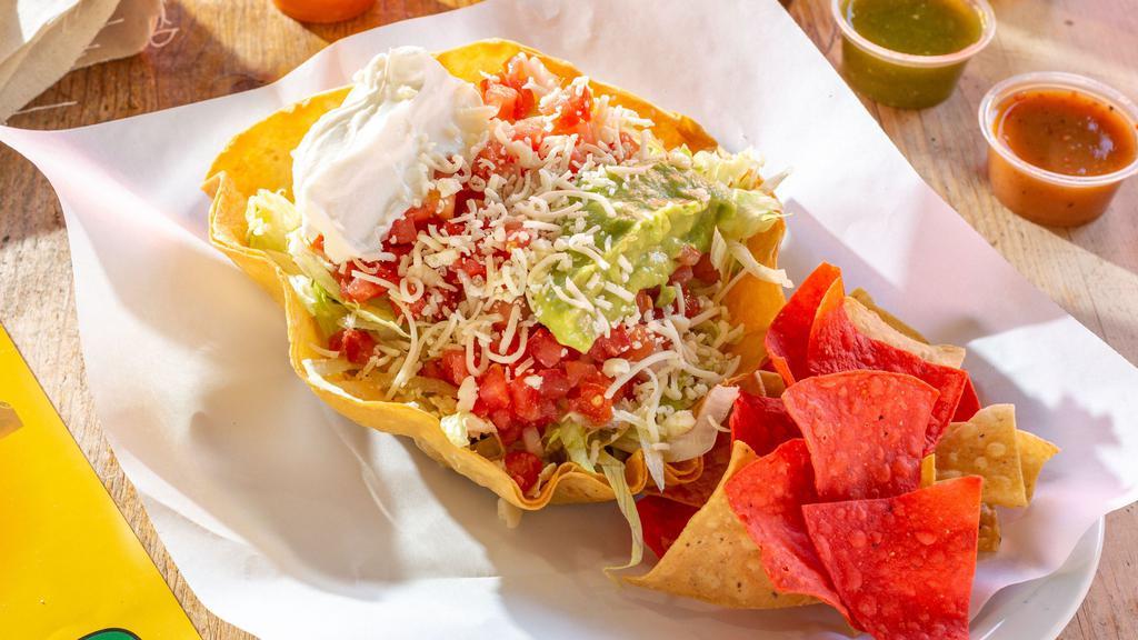 Mexican Tostada (Small) · Choice of chicken or pork with beans, lettuce, sour cream, and cheese on a tostada.