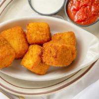 Fried Mac & Cheese · Creamy squares of mac and cheese rolled in bread crumbs then fried to perfection and served ...