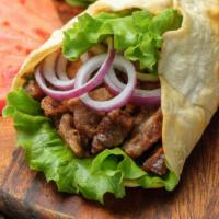 Shawarma Chicken Wrap · Flavorful rotisserie chicken, locally grown  lettuce, and creamy tzatziki wrapped in a warm ...