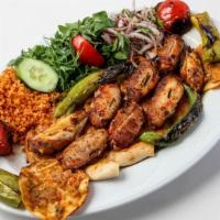 Chicken Kabob Entrée · Marinated pieces of chicken breast grilled to perfection, served with rice and grilled veget...