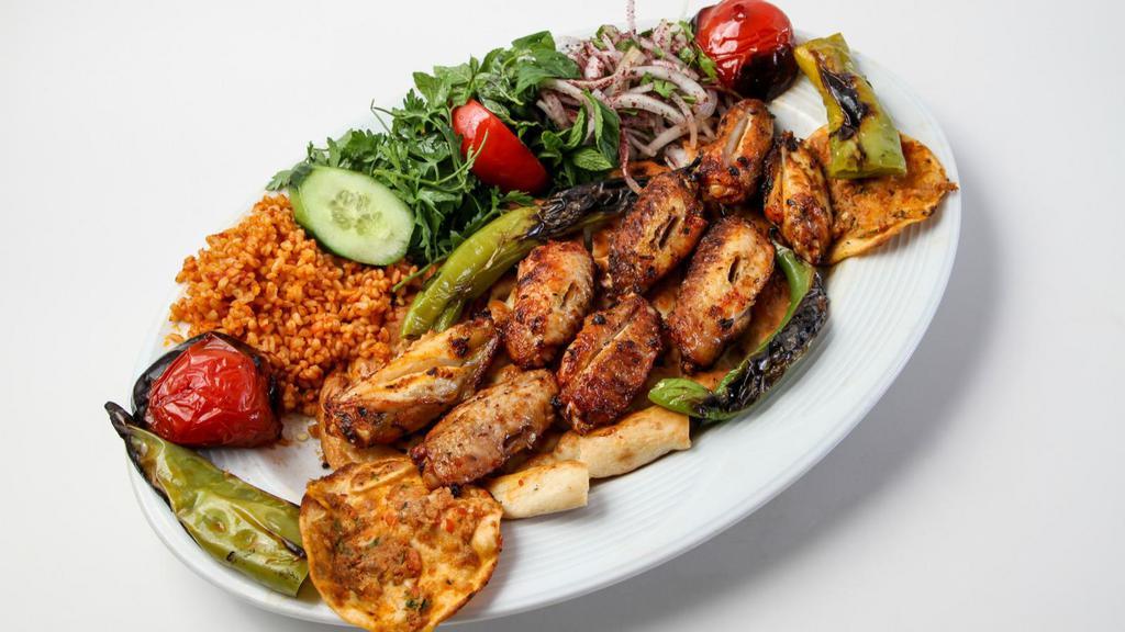 Shawarma Chicken Plate · Boneless marinated slices of chicken, slowly roasted to perfection. Served with rice, hummus, salad, and pita bread.