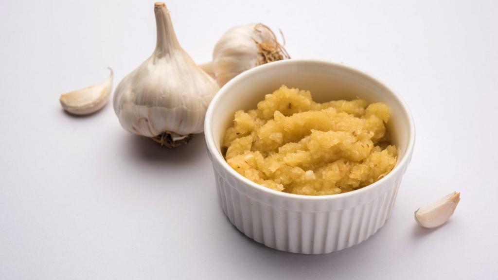 Garlic Paste · Locally grown garlic made into a creamy paste sauce.