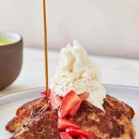 Vanilla Brioche French Toast · seasonal berries, homemade whipped cream, & maple syrup