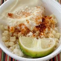 Esquite · Corn, mayo, cotija cheese, butter chili powder, and lime.
