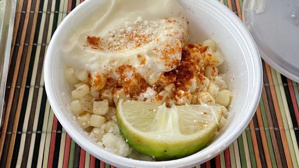 Esquite · Corn, mayo, cotija cheese, butter chili powder, and lime.