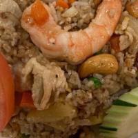 Pineapple Fried Rice · Jasmine rice stir fried with 2 shrimp, chicken, egg, pineapple, cashew, onion, and carrot.