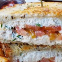 Signature Tuna Melt · Toasted rye bread, swiss cheese, sliced tomatoes