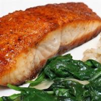 Cedar Plank Salmon · Sweet and smokey cajun seasoning served with garlic spinach and wild rice pilaf with almonds