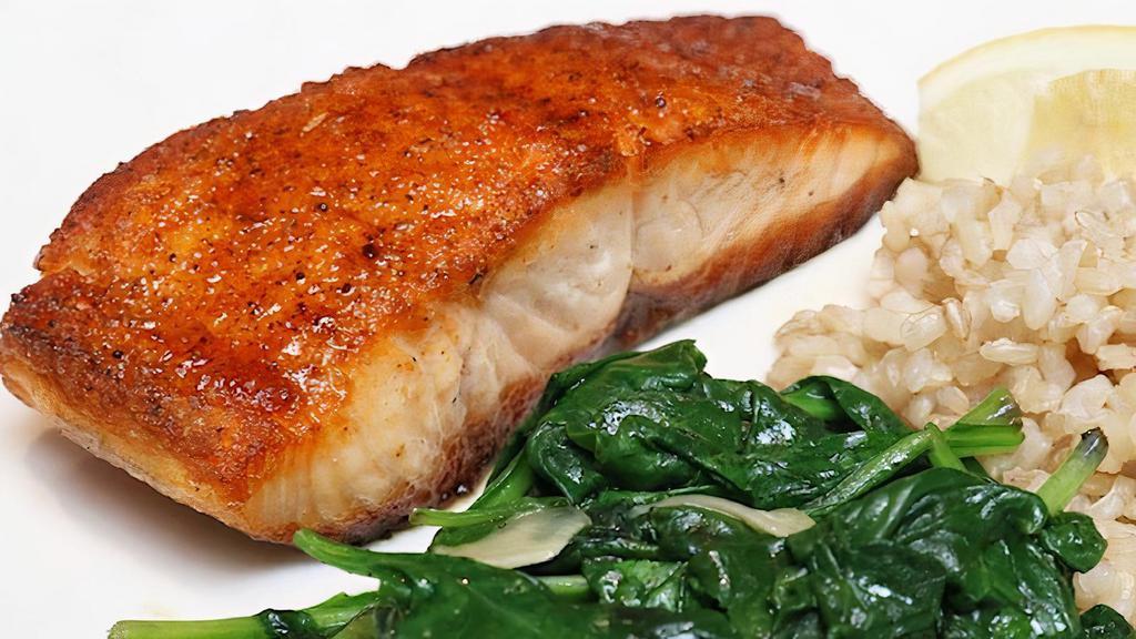 Cedar Plank Salmon · Sweet and smokey cajun seasoning served with garlic spinach and wild rice pilaf with almonds