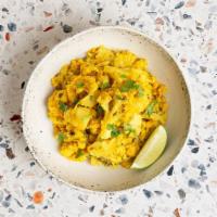 Aloo Gobhi · Potatoes and cauliflower cooked with ground spices and curry sauce.