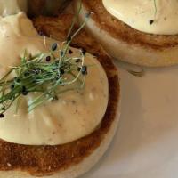 Eggs Benedict · Oven-roasted house-made pork porchetta served on two toasted English muffin halves each topp...