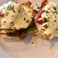 Veggie Benny · Two English style muffin halves topped with melted havarti cheese, sautéed local onions, mus...