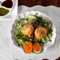 Vegetables Samosa · 2 pieces. Deep fried pastry stuffed with spices potatoes and green peas. Serve with tamarind...